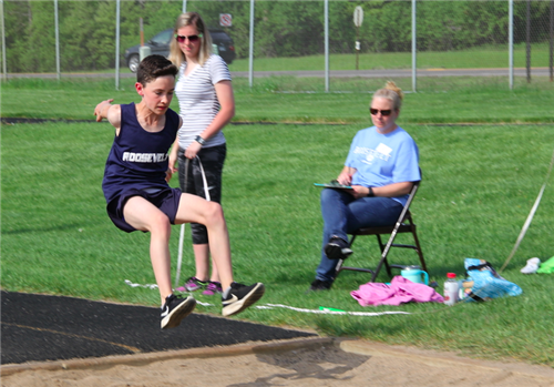 Boy doing long jump Boy doing long jump
